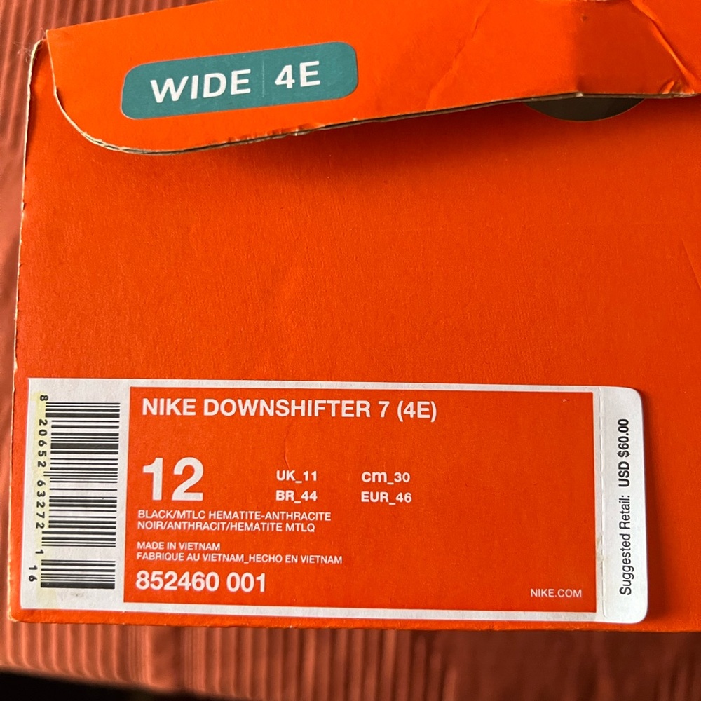 Men’s 12 4E Nike. Only worn twice. Small stain shown on top (as shown)